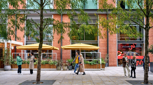 People walking in front of building at Canary Wharf